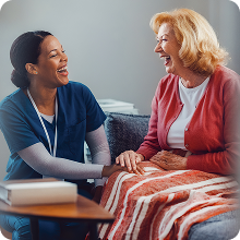 dr and patient sitting and laughing