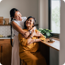 daughter hugging mother