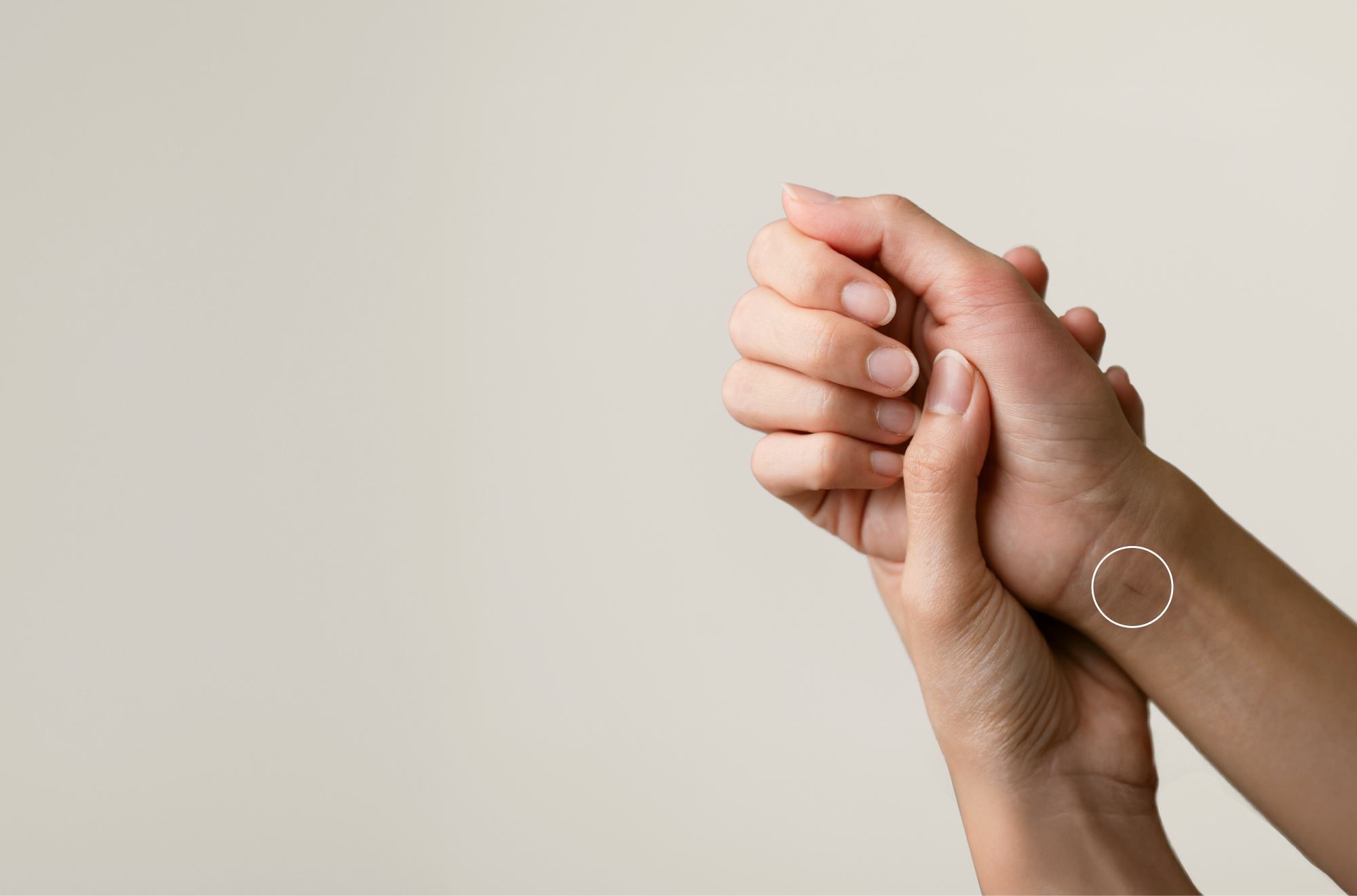 left handing holding right with circle over scar